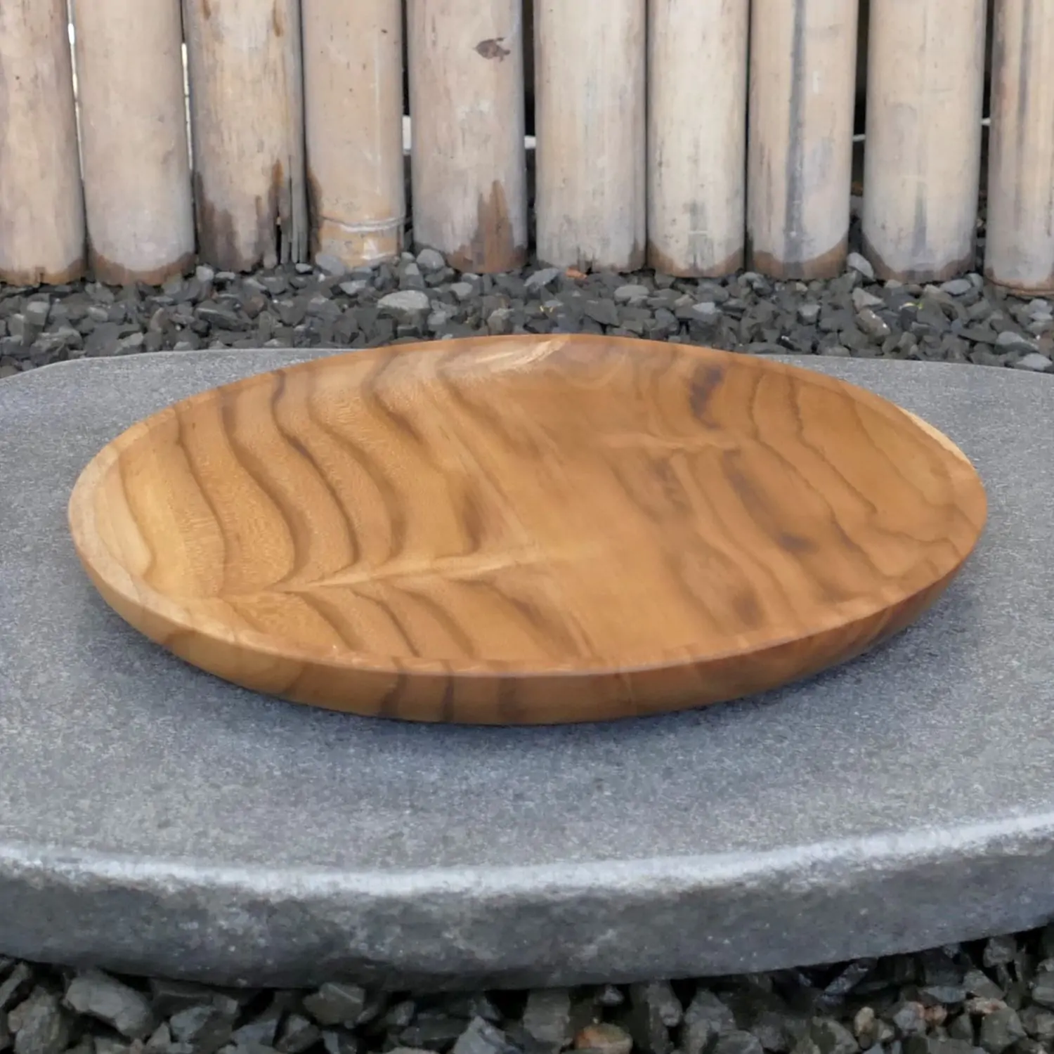  Product image 1 of the product “Wooden plate, made of teak wood, 25 cm dia. ”